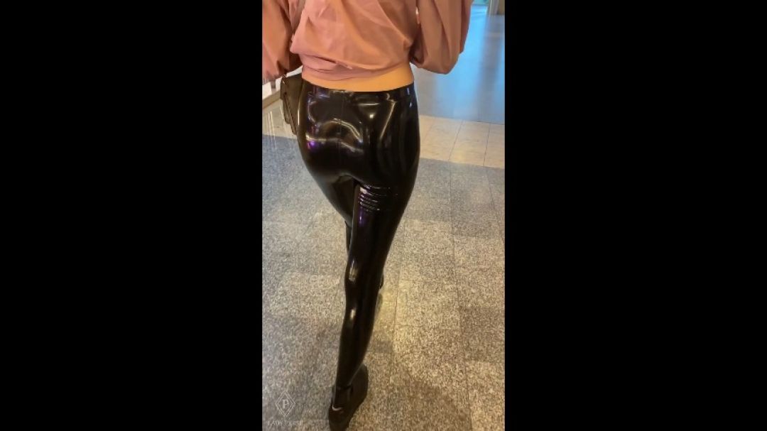 Public walk in city mall in latex leggings