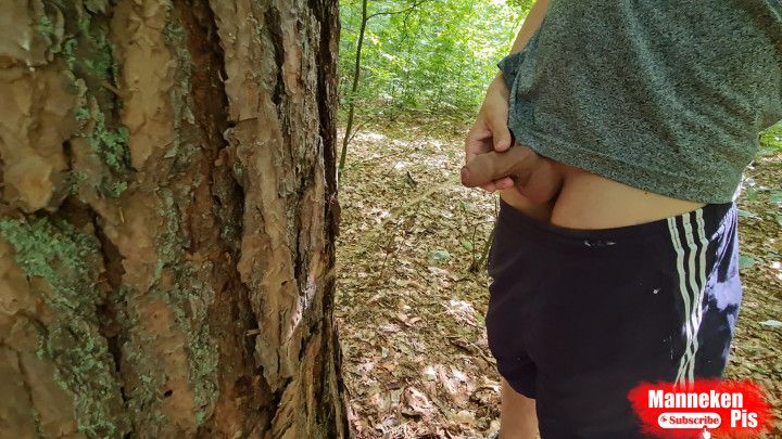 Pissed on the tree. Naked walk in the woods