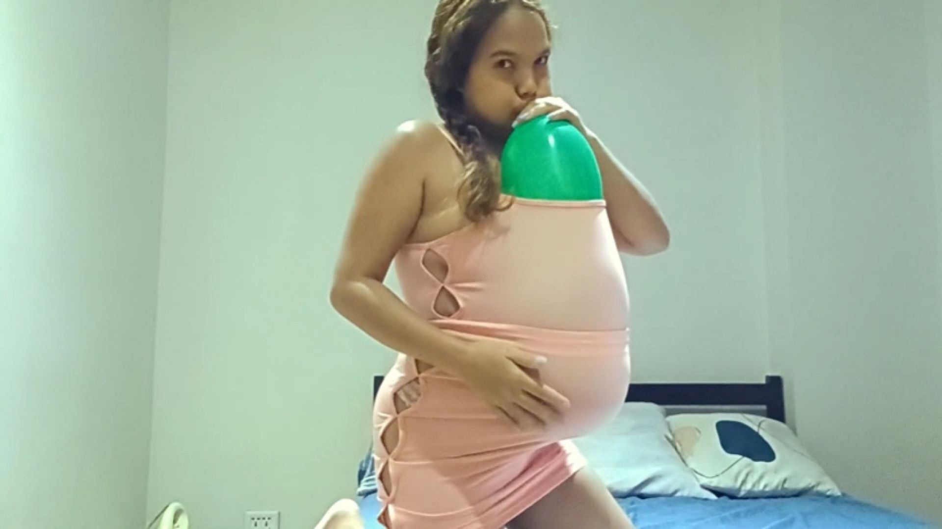 Sexy Juju Blows Up Green Balloon Under Her Dress