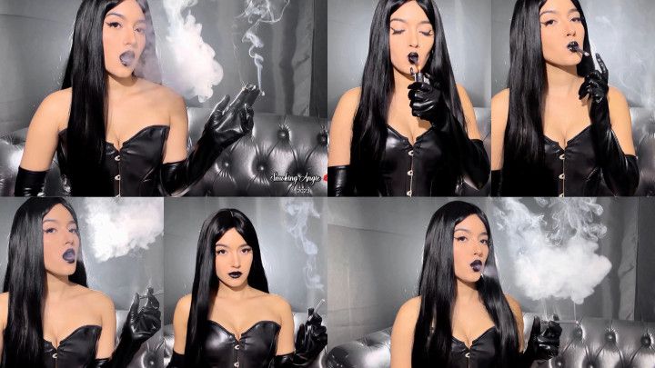 Black hair, leather corset, leather gloves, black lips