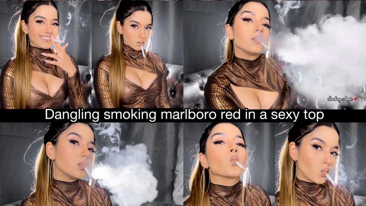 Dangling smoking marlboro red in a low cut top, ponytail