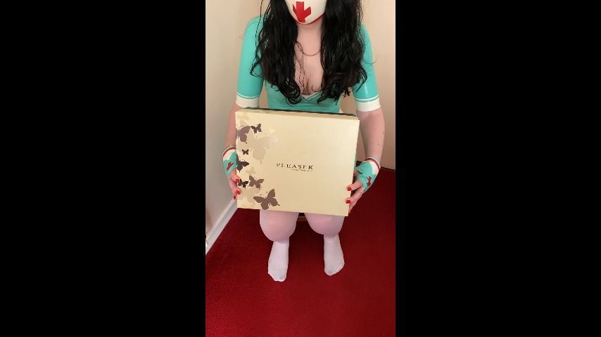 Unboxing boots wearing nurse latex