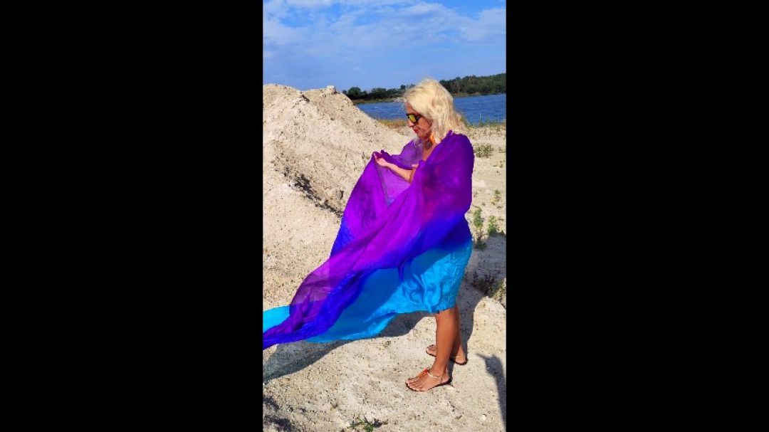 Naked Salome veil dance on the beach