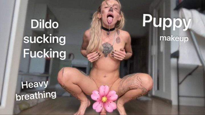 She fucks a dildo with a puppy make-up, heavy breathing