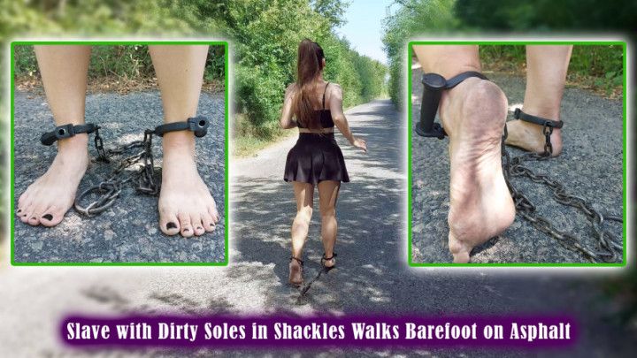 Slave with Dirty Soles in Shackles Walks Barefoot on Asphalt