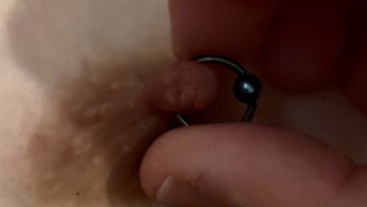 Close up nipple play with pierced nips