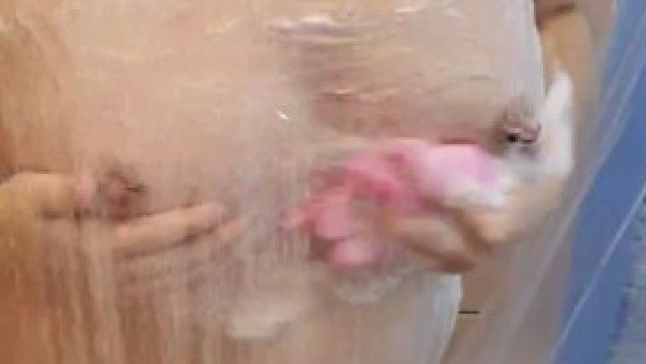 Young MILF showering