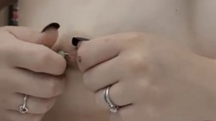 Watch a milf change her nipple rings