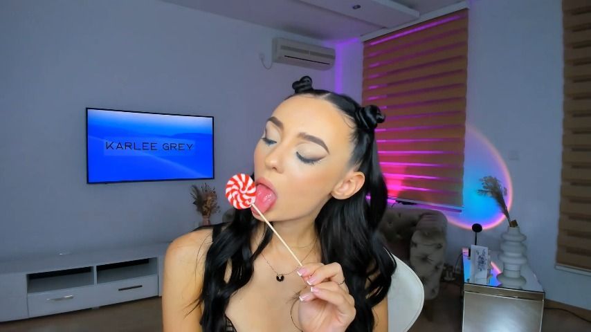 Teen girl playing with lollipop