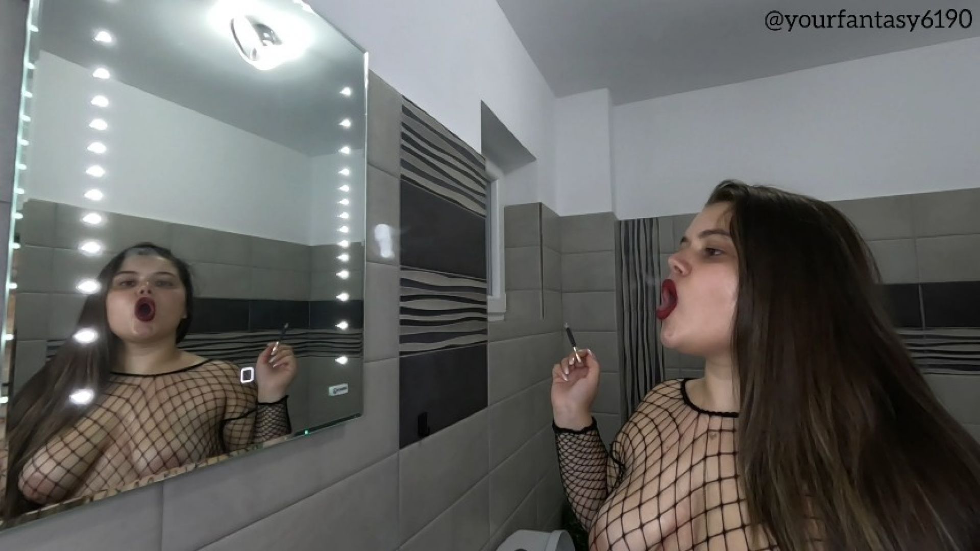 Sexy smoker in fishnets