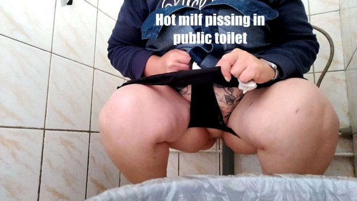 Hot milf pissing in public toilet