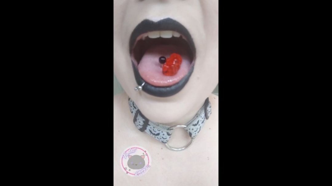 goth girl swallows a tiny gummy