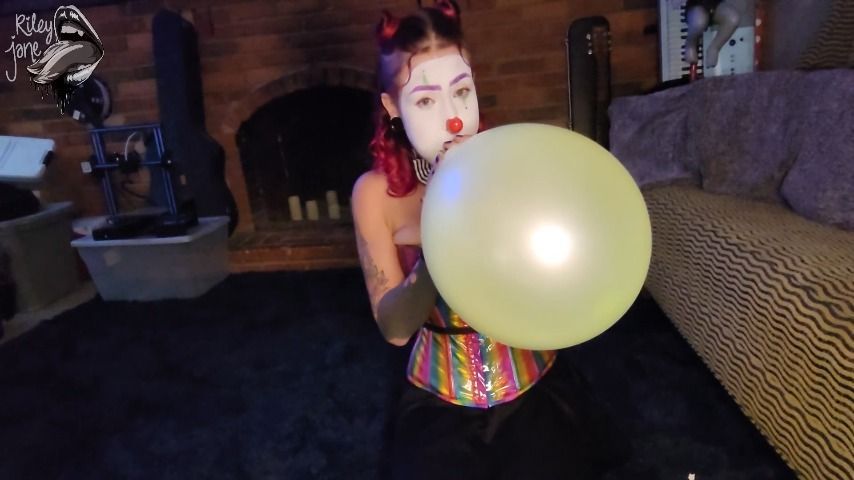 Clown Girl Pops Her Balloons