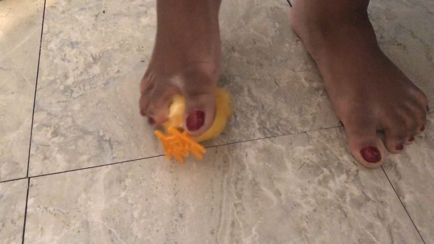 stomping on toy chick barefoot