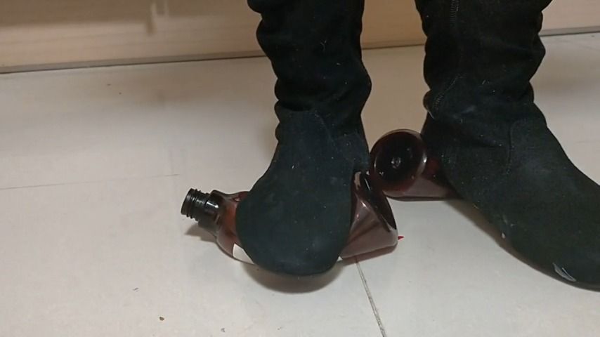 stomping on two bottles in boots