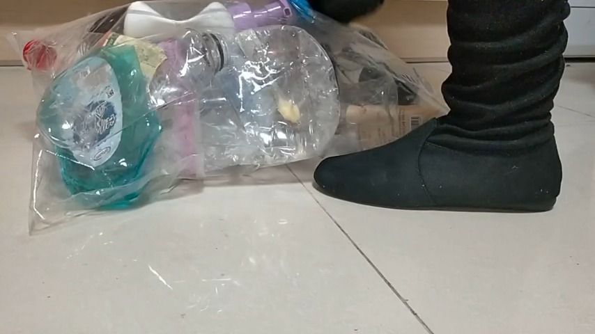 stomping on bag full of bottle in boots