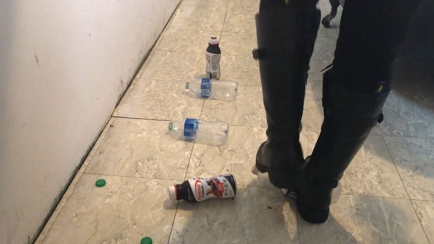 stomping on trail of bottles in boots