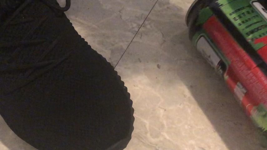 stomping on can in sneakers