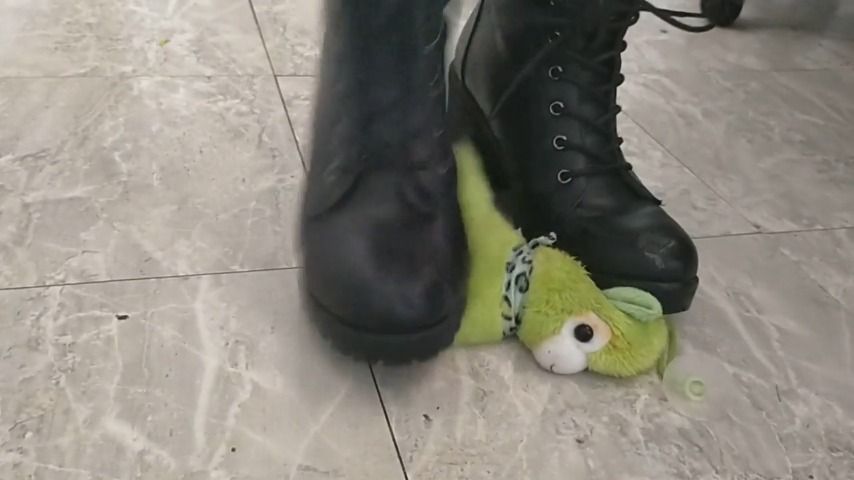 Stomping on toy in black boots