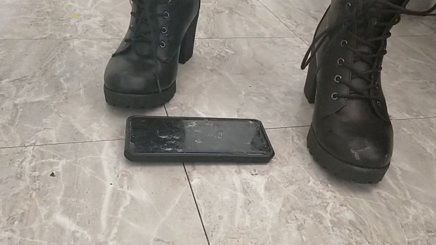 Stomping on cell phone in sexy boots