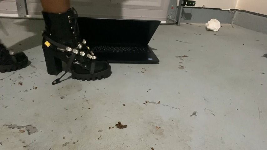 stomping slave's laptop in sexy boots