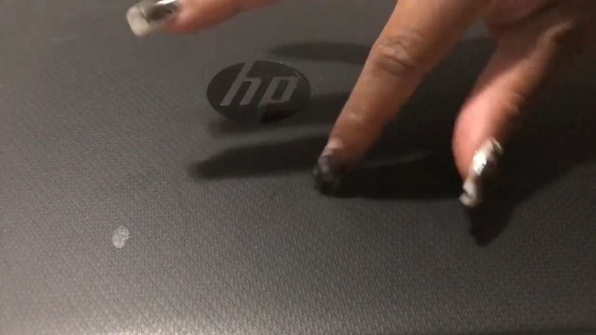 Nails tapping on top of laptop