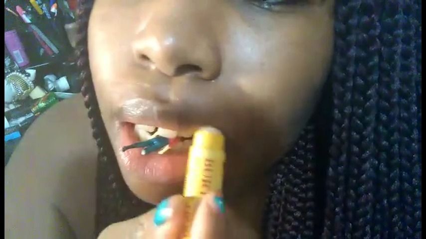 Giantess moistening her lips with tiny