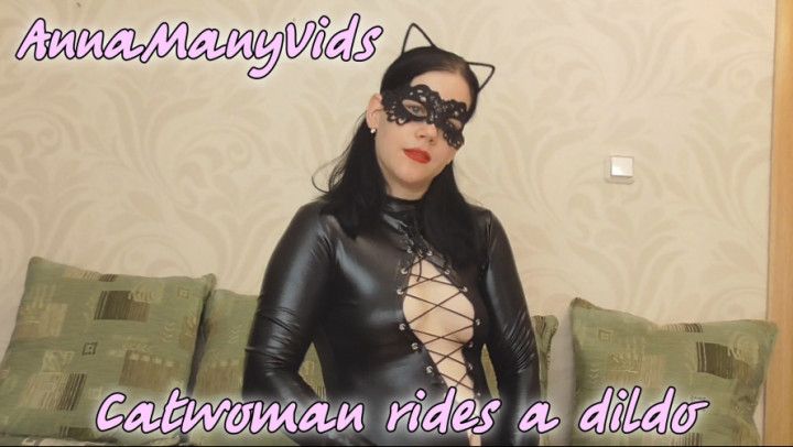 Catwoman rides a dildo