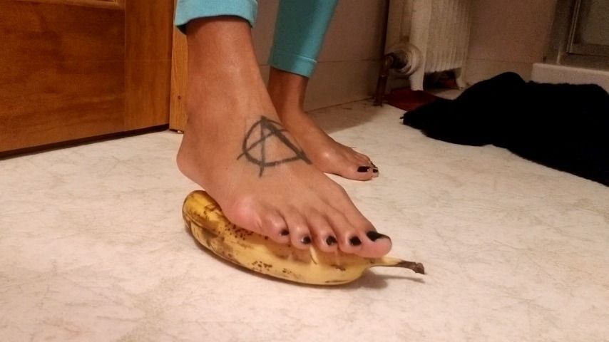 My perfect feet stepping on a banana