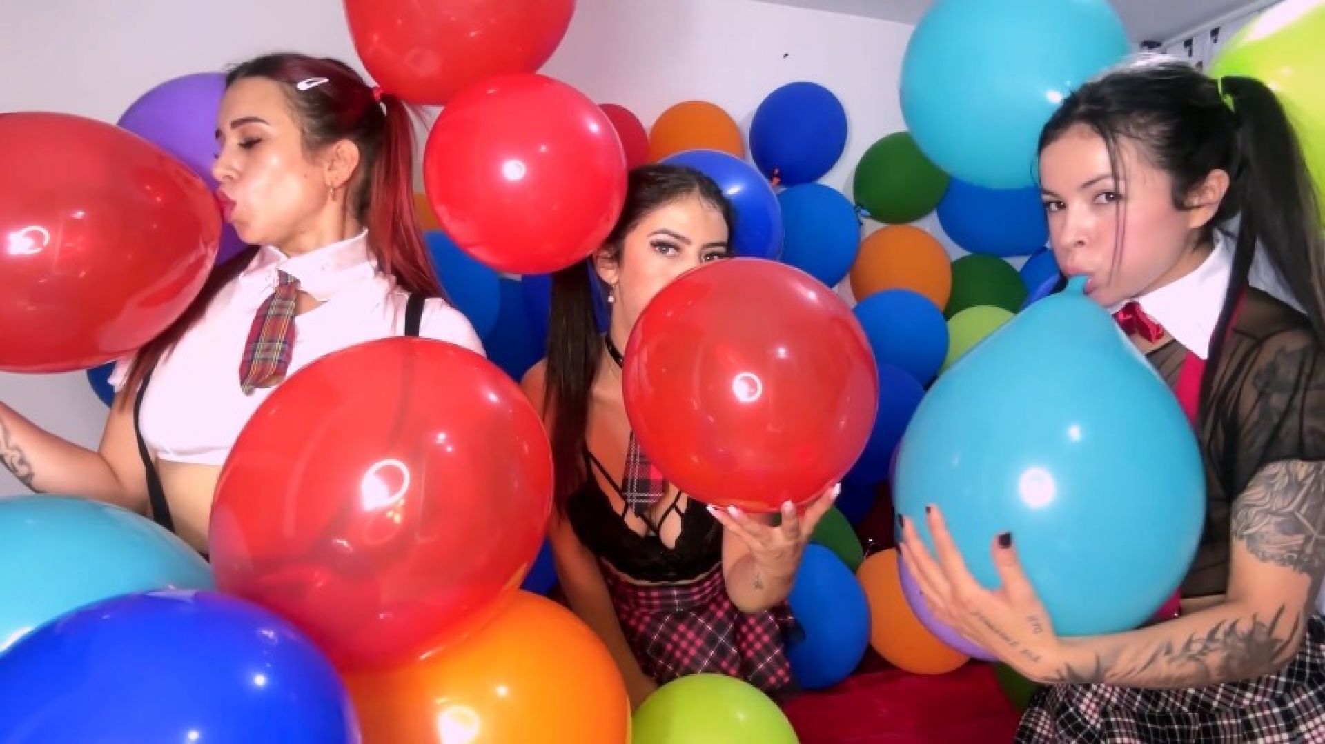 Horny schoolgirls blowing up balloons