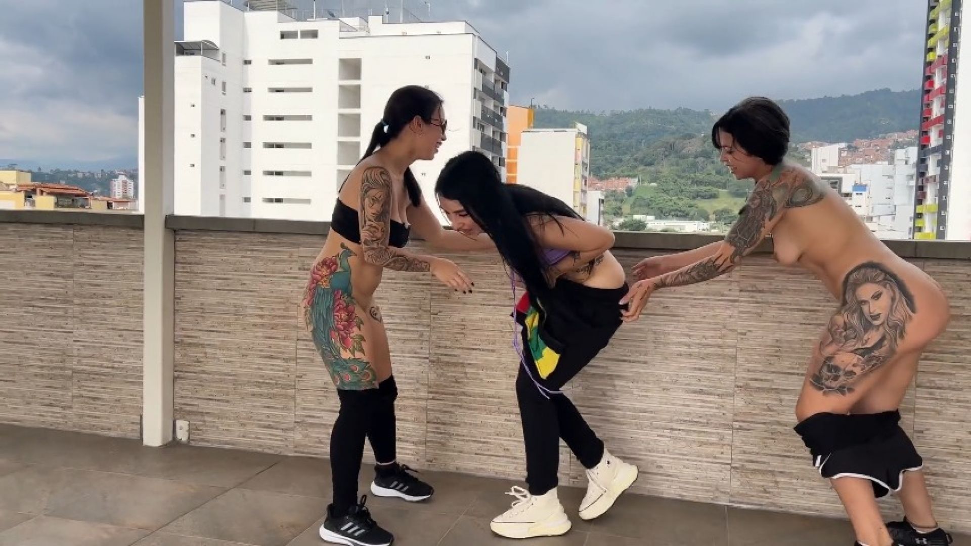 Playing to pull down our pants on a terrace