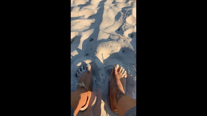 Sunbathing my feet in the sand