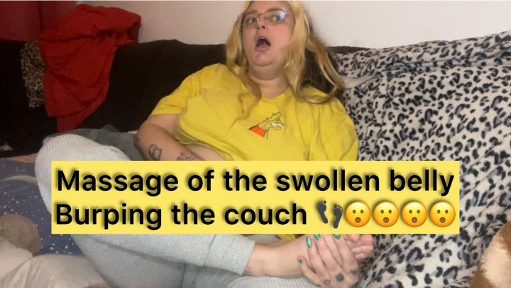 Massage of the swollen belly Burping the couch