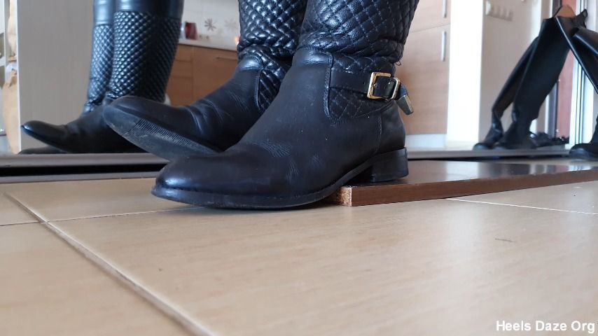 Toe Tapping in Two Pairs of Leaher Boots