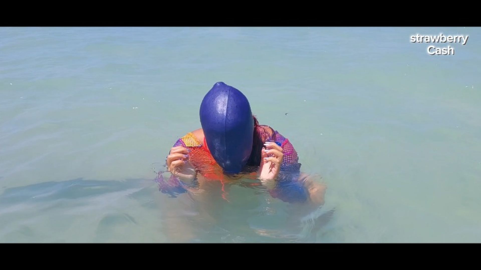 Swimcap and head dunking in the sea