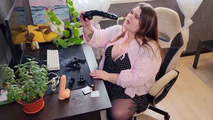 Russian Sex Shop Chubby Assistant Shows a Dildo Collection