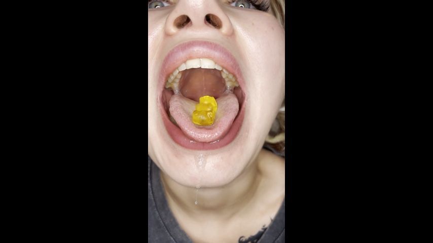 Swallowing a candy with an open mouth