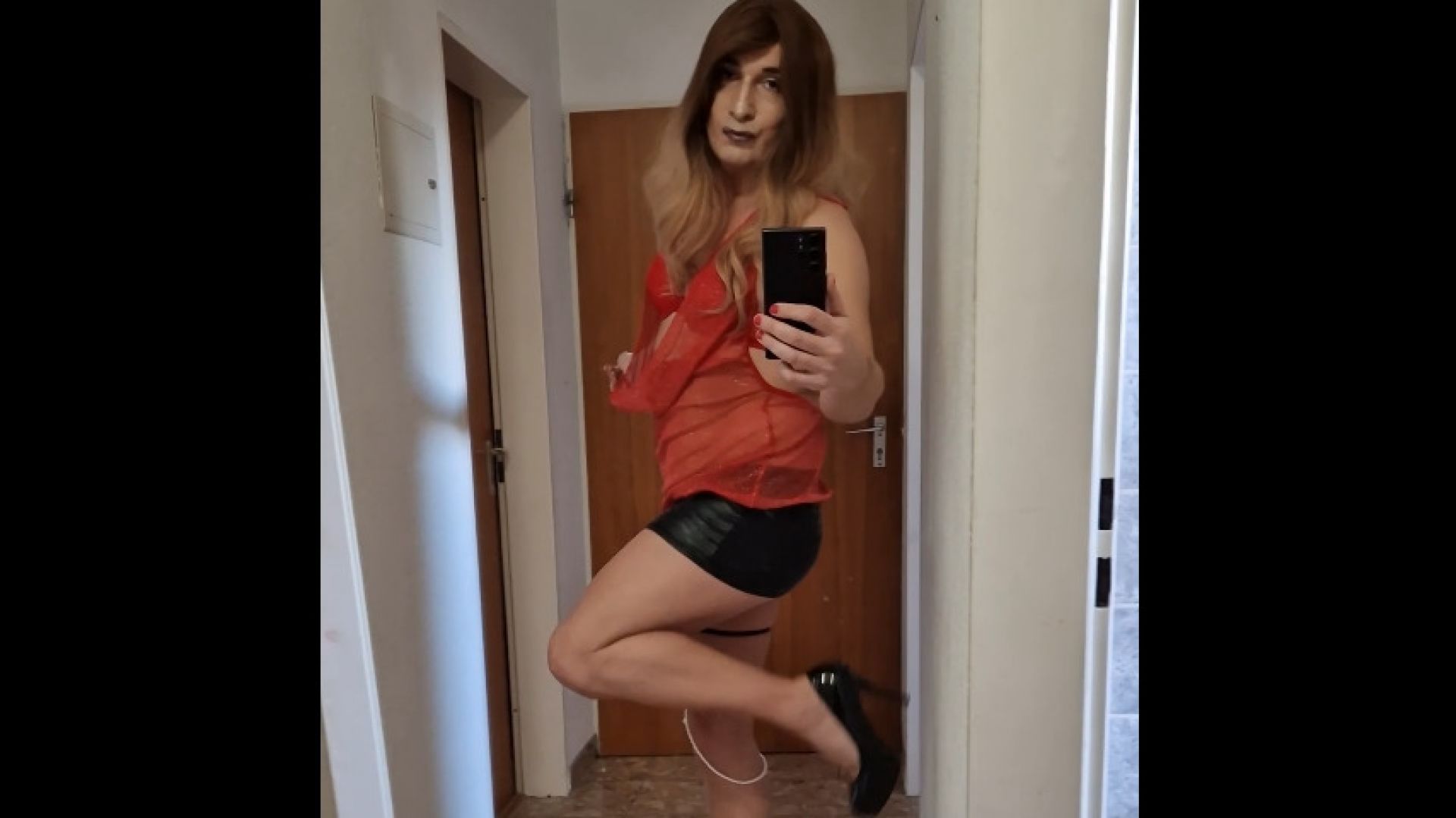 Sexy mature tranny in red shots a nice cumload out again