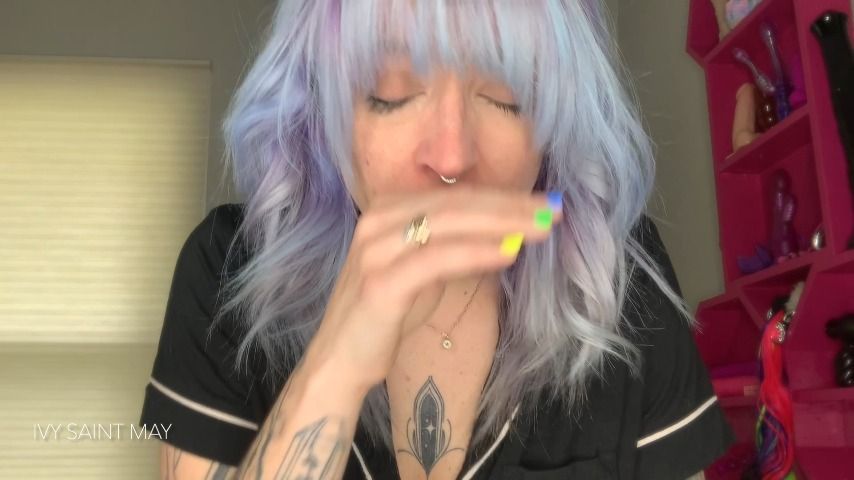 Tattooed girl sniffs sneezing powder