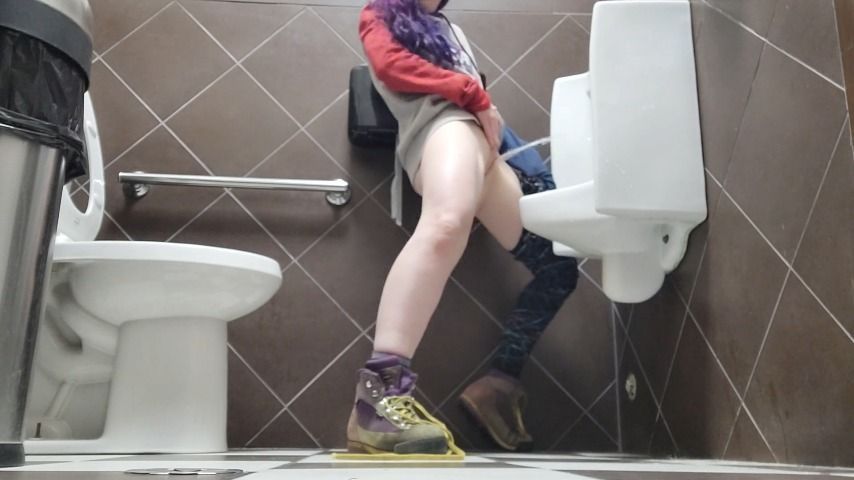 Girl Using a Public Urinal