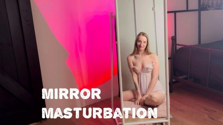 Petite teen masturbates while looking in the mirror