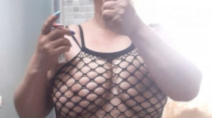 Sexy smoking in mesh dress