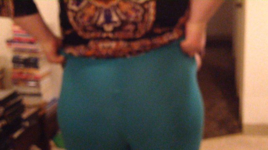 Molly is dancing in her blue leggings showing off her bottom