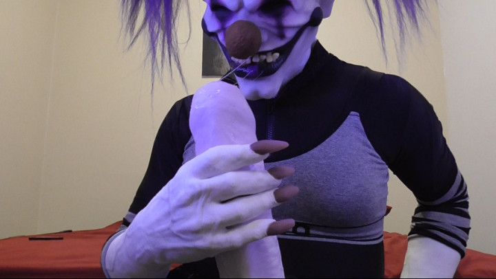 Nasty clown stroking and cumming