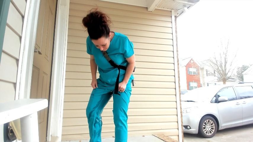 pees pants in scrubs