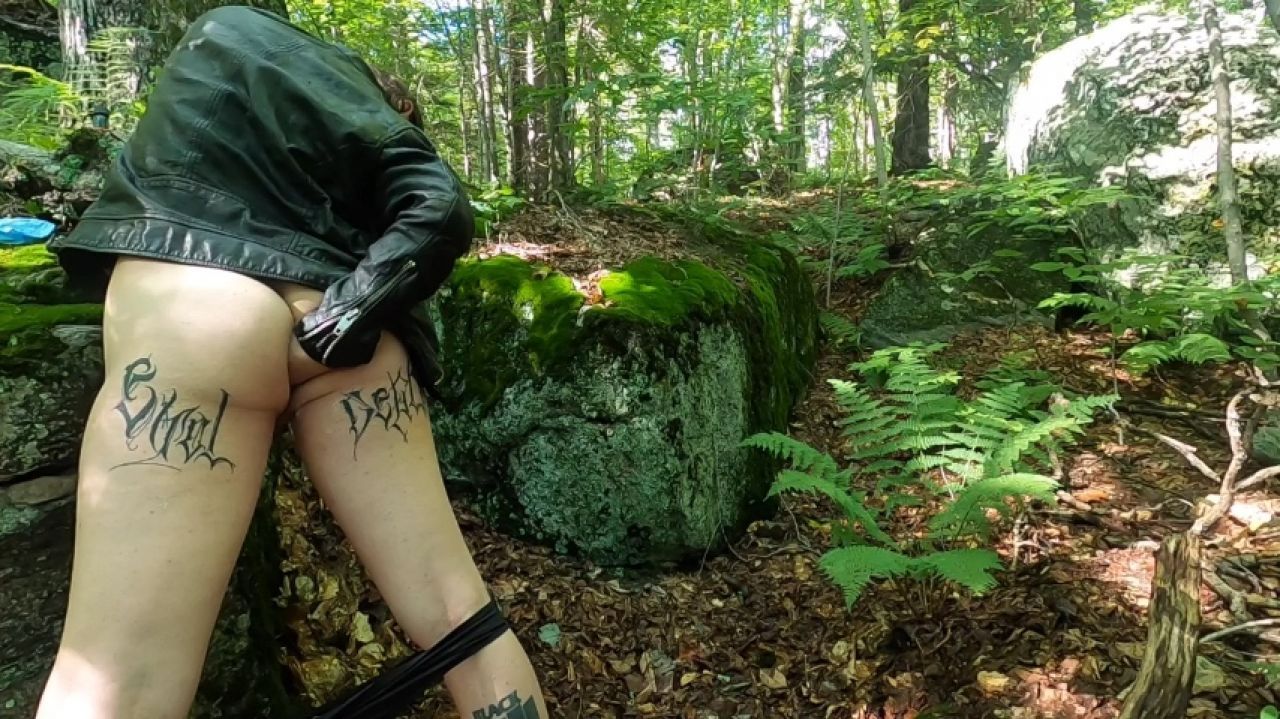 Tgirl Motodyke toys with her giant hole in the forest