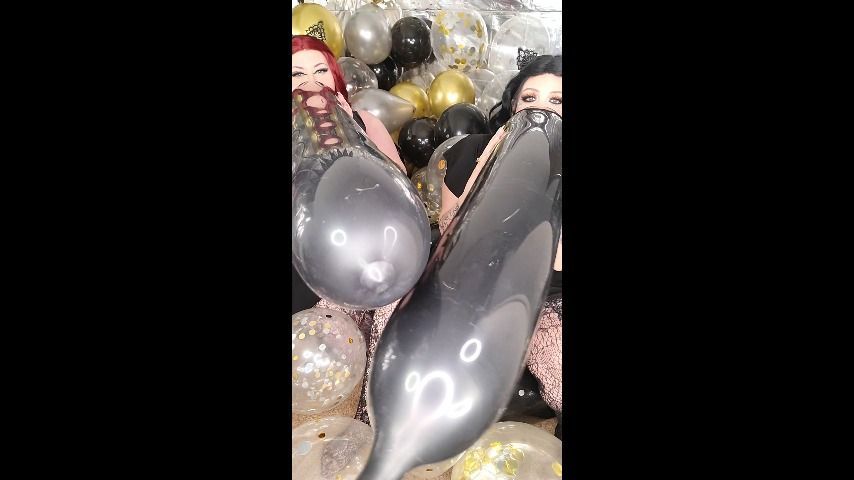 Goth GFs blow long black balloons