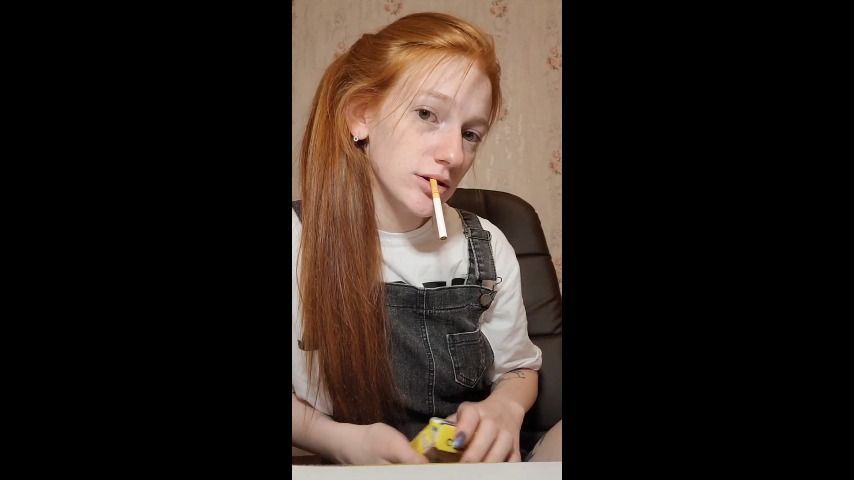 Cute redhead smoking