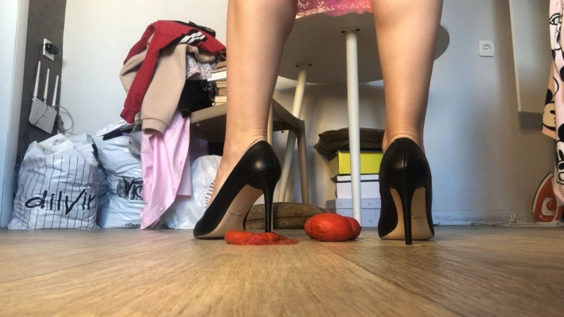 Crush tomatoes with heels and bare feet