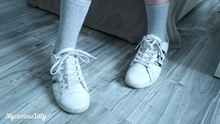 White dirty adidas sneakers